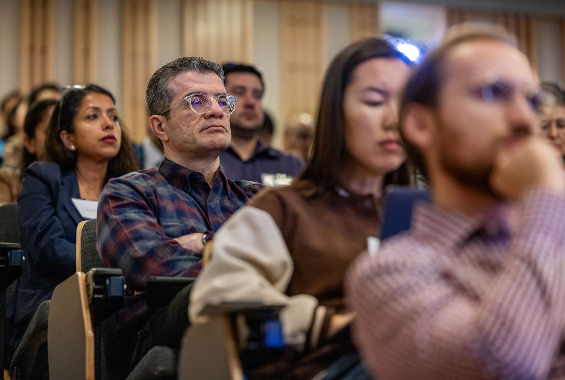 seated attendees listening to a presentation