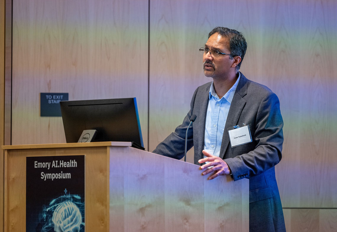 Anant Madabhushi speaking at a podium