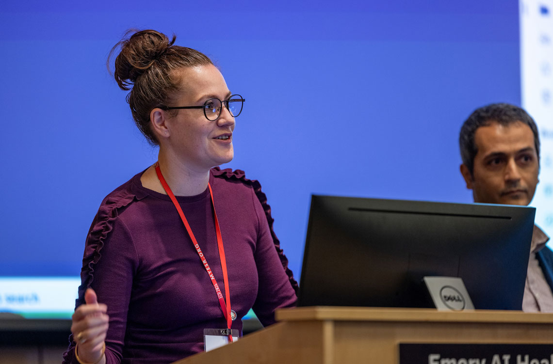 a woman speaking at a podium