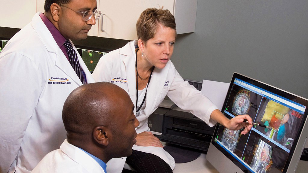 Emory Healthcare doctors examining tissue scans